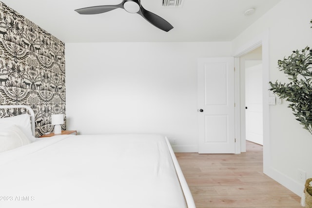 bedroom featuring ceiling fan and light hardwood / wood-style floors