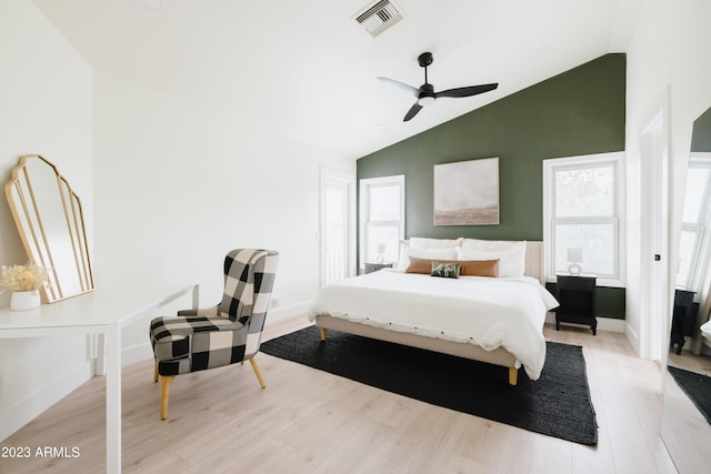 bedroom featuring vaulted ceiling, ceiling fan, and light wood-type flooring