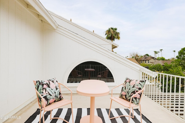 view of patio featuring a balcony