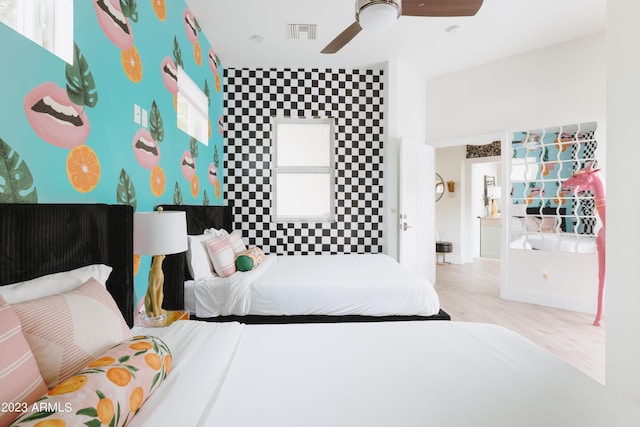 bedroom featuring ceiling fan and light hardwood / wood-style floors