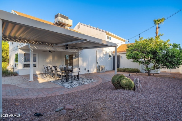 view of patio with central AC and ceiling fan