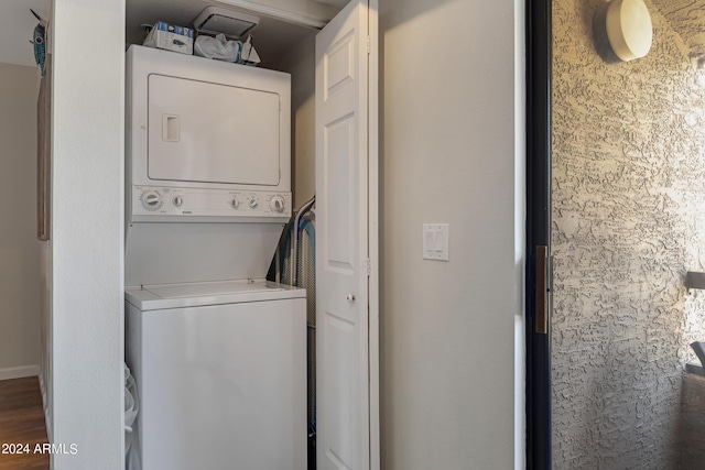 laundry area featuring laundry area and stacked washer / dryer