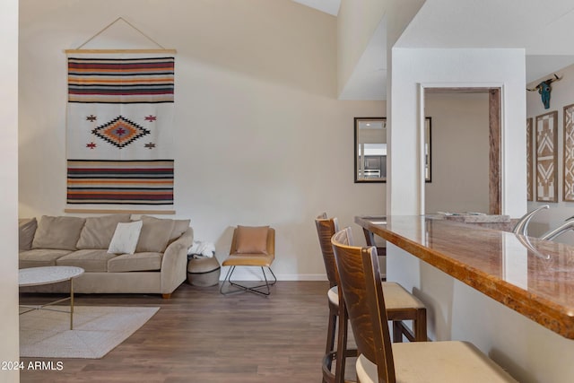 living room with baseboards and wood finished floors