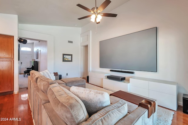 living room featuring vaulted ceiling, ceiling fan, and hardwood / wood-style floors