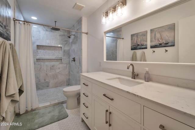 bathroom featuring walk in shower, vanity, and toilet