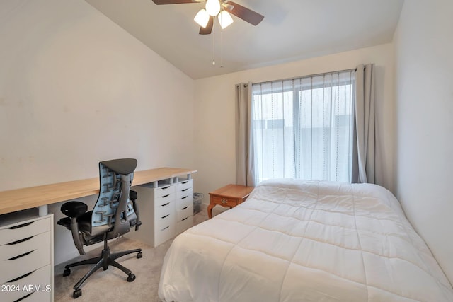 carpeted bedroom featuring vaulted ceiling and ceiling fan