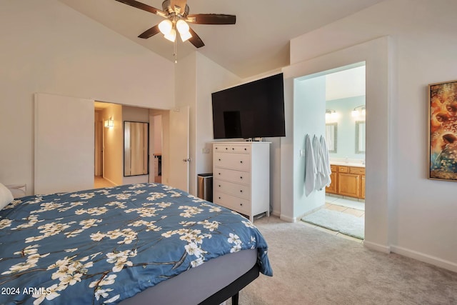 carpeted bedroom featuring high vaulted ceiling, connected bathroom, and ceiling fan