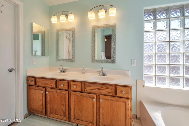 bathroom featuring a tub and vanity