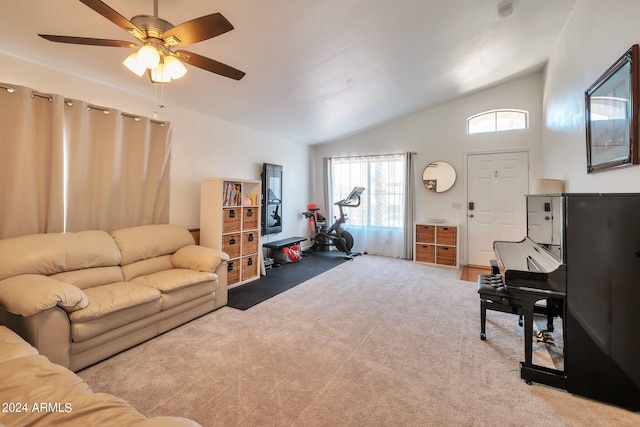 living room with lofted ceiling, carpet flooring, and ceiling fan