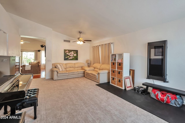 living room with carpet, lofted ceiling, and ceiling fan