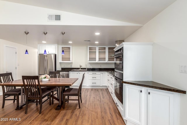 dining area with visible vents, wood finished floors, and recessed lighting