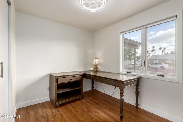 office area featuring baseboards and wood finished floors