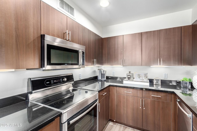 3635 N 68th St Unit 5, Scottsdale, AZ 85251 - kitchen featuring appliances with stainless steel finishes and modern cabinets