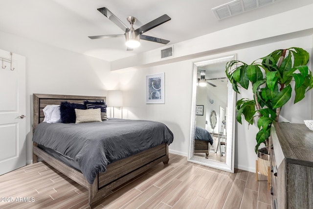 3635 N 68th St Unit 5, Scottsdale, AZ 85251 - bedroom with light wood-type flooring, a ceiling fan, and baseboards