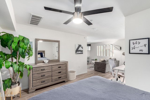 3635 N 68th St Unit 5, Scottsdale, AZ 85251 - bedroom with light wood-style flooring and a ceiling fan