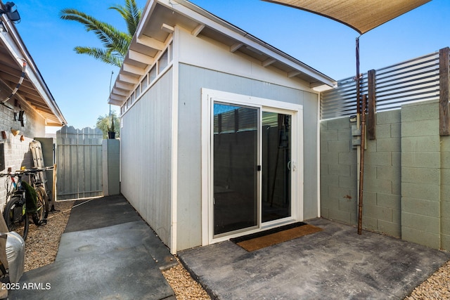 entrance to property featuring a patio