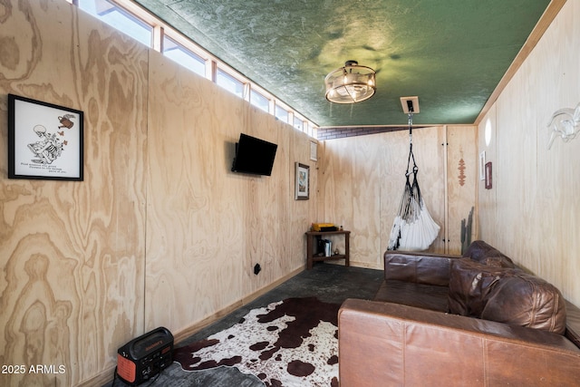 living room with wood walls