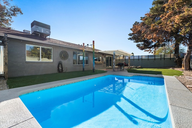 view of swimming pool featuring a pergola, a lawn, central AC, and a patio