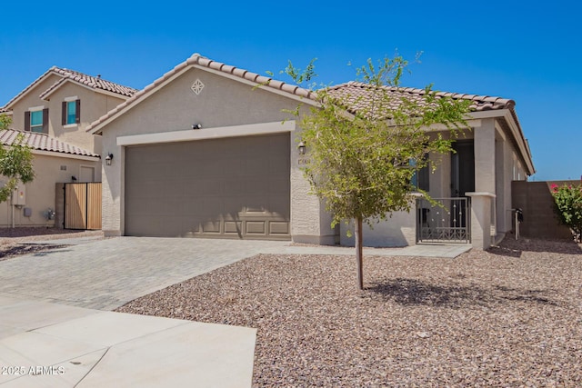 17918 W Toronto Way, Goodyear, AZ 85338 - view of front of property featuring an attached garage, driveway, stucco siding, and a tile roof