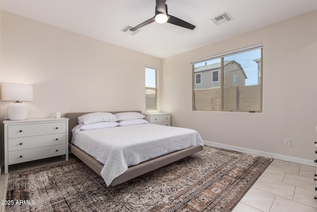 17918 W Toronto Way, Goodyear, AZ 85338 - bedroom featuring light tile patterned floors and ceiling fan