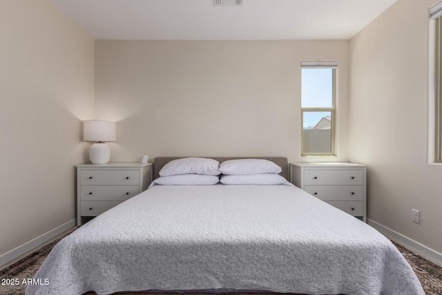 17918 W Toronto Way, Goodyear, AZ 85338 - bedroom with baseboards and dark wood-style floors
