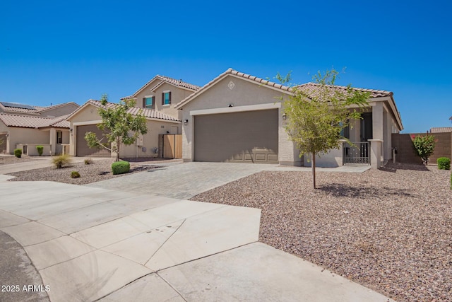 17918 W Toronto Way, Goodyear, AZ 85338 - view of front of property with driveway, a garage, stucco siding, and a tiled roof