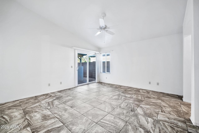 empty room with ceiling fan and lofted ceiling