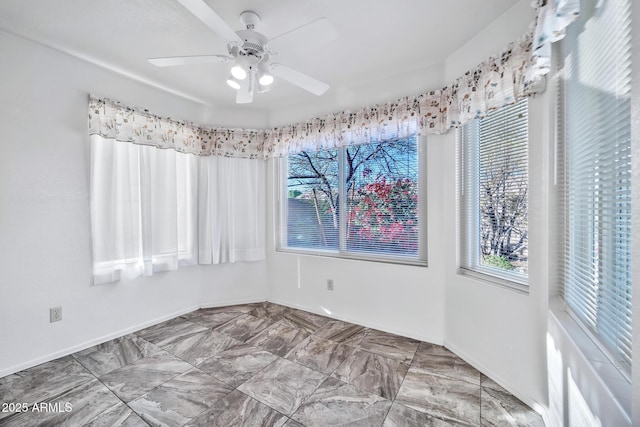 empty room featuring ceiling fan