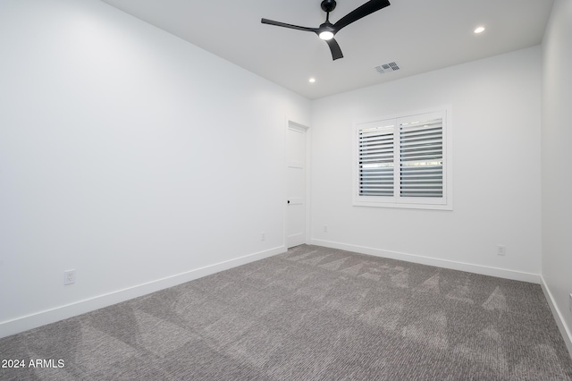 carpeted empty room featuring ceiling fan