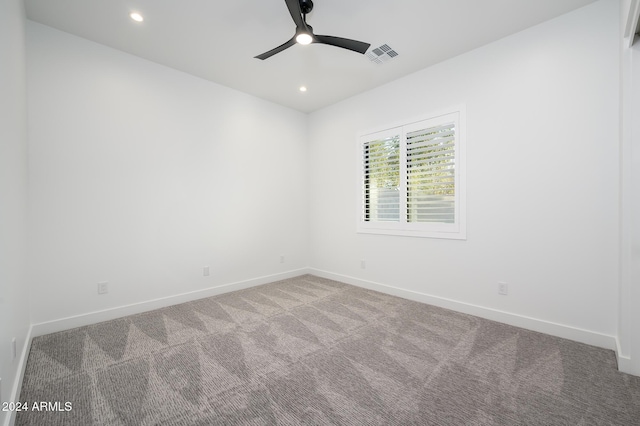 carpeted empty room with ceiling fan