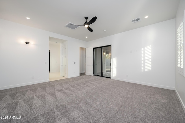 carpeted empty room with ceiling fan