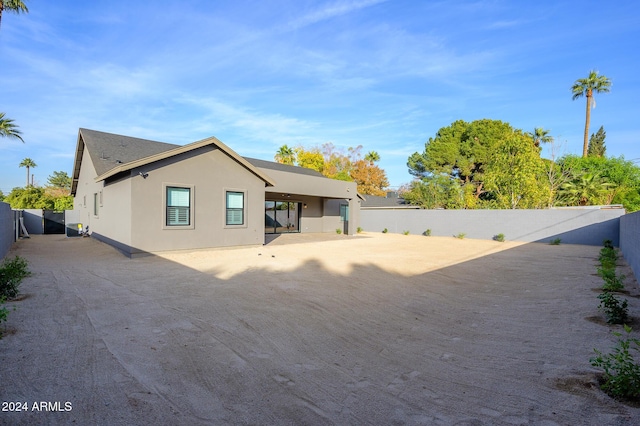 rear view of property featuring a patio