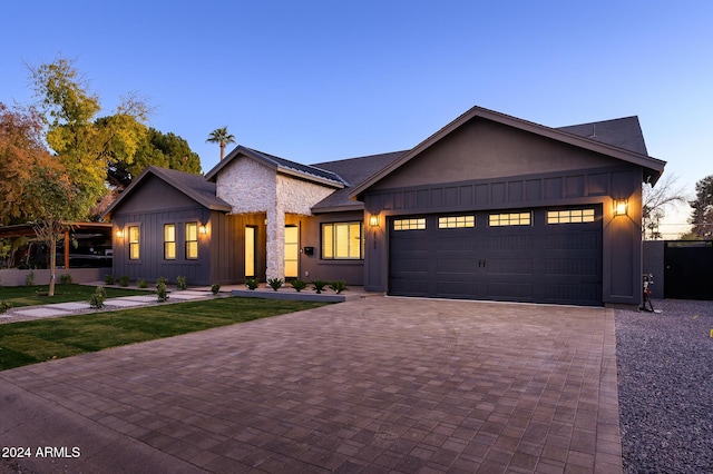 modern farmhouse style home with a garage