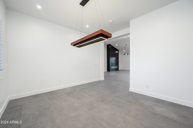 empty room with concrete flooring