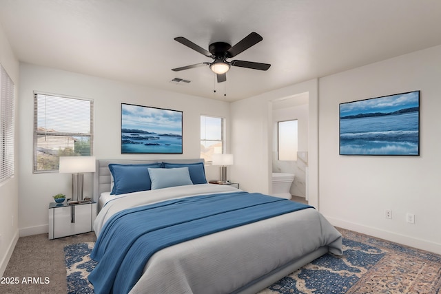 carpeted bedroom featuring connected bathroom and ceiling fan