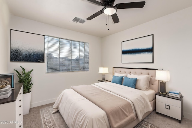 bedroom featuring light carpet and ceiling fan