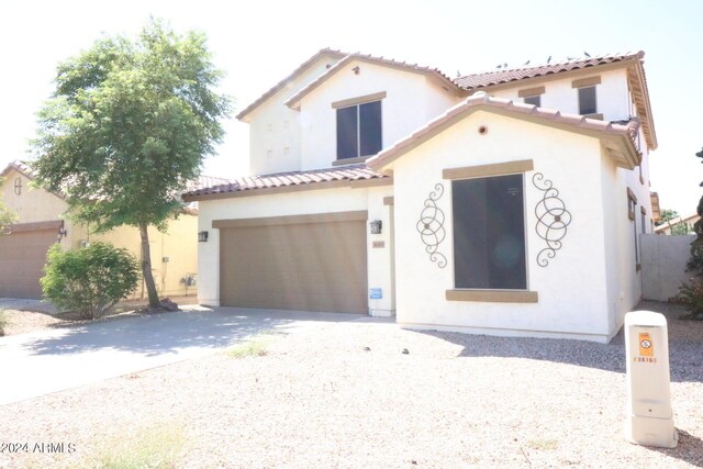 mediterranean / spanish-style house featuring a garage