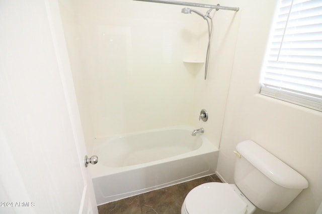 bathroom with toilet and bathtub / shower combination