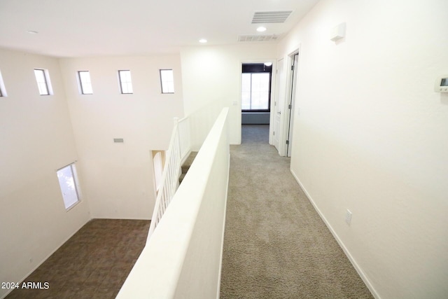 hallway with carpet floors