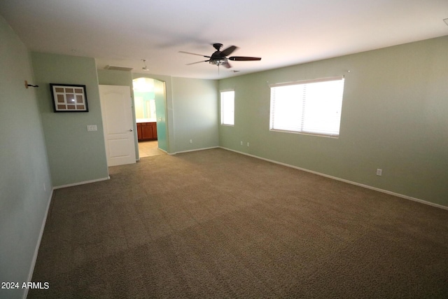 carpeted empty room with ceiling fan