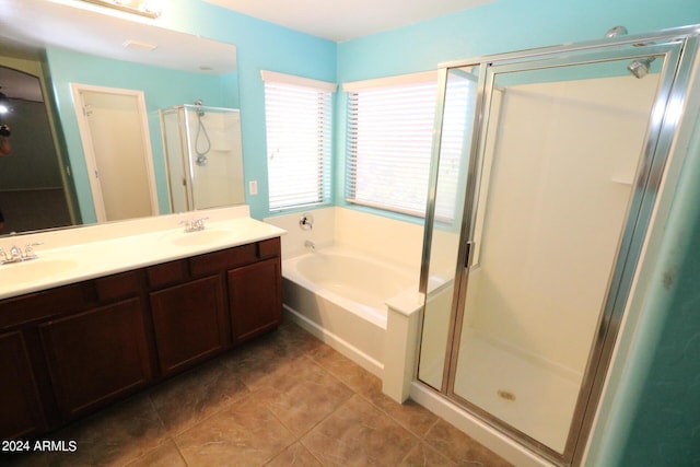 bathroom with vanity, plus walk in shower, and tile patterned flooring