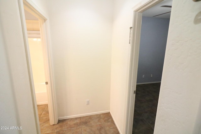 hallway featuring light tile patterned floors