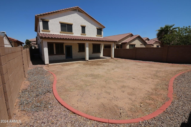 back of house with a patio area