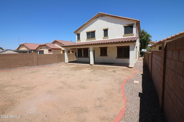 back of property featuring a patio