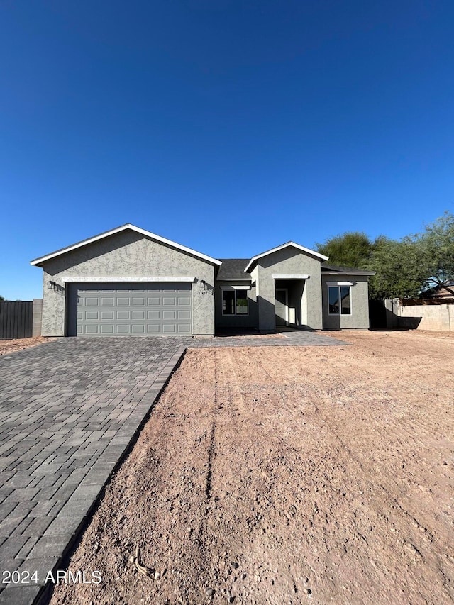 ranch-style house featuring a garage