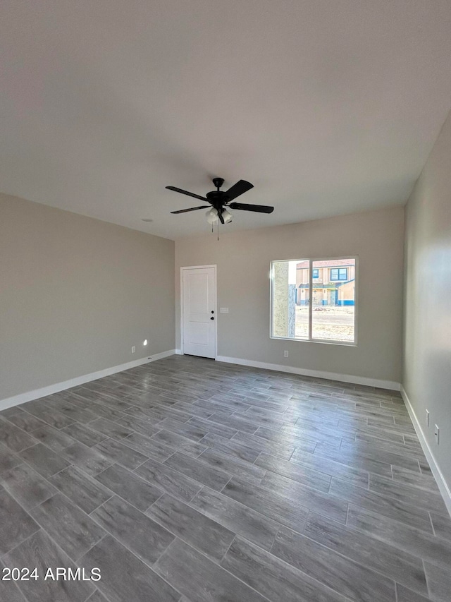 interior space featuring dark hardwood / wood-style flooring and ceiling fan