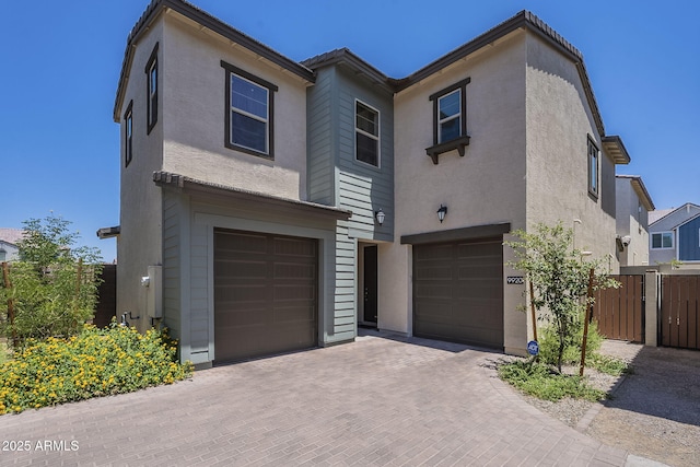 9920 E Tamery Ave, Mesa, AZ 85212 - view of front of house with an attached garage, stucco siding, and decorative driveway