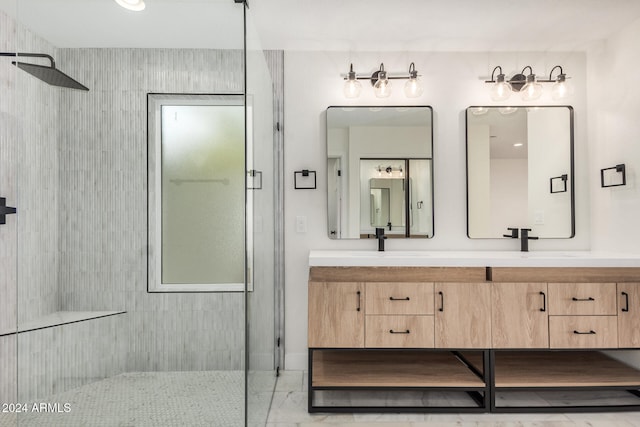 bathroom featuring vanity and tiled shower