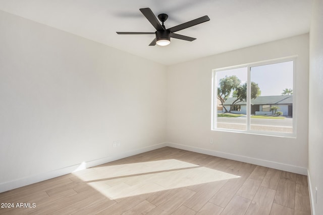 unfurnished room with ceiling fan and light hardwood / wood-style flooring