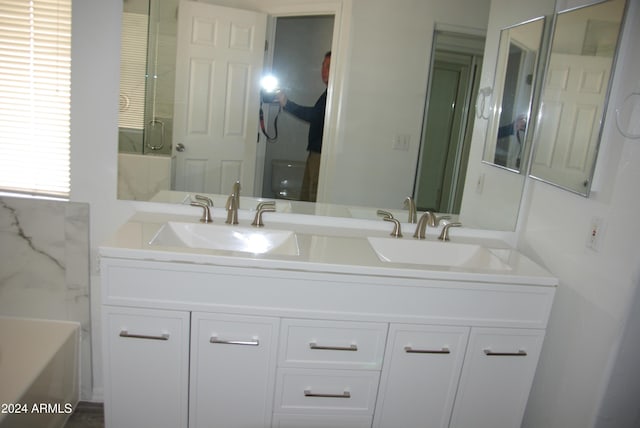 bathroom with vanity and separate shower and tub